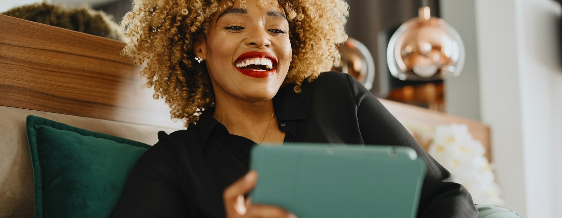 a woman holding a laptop