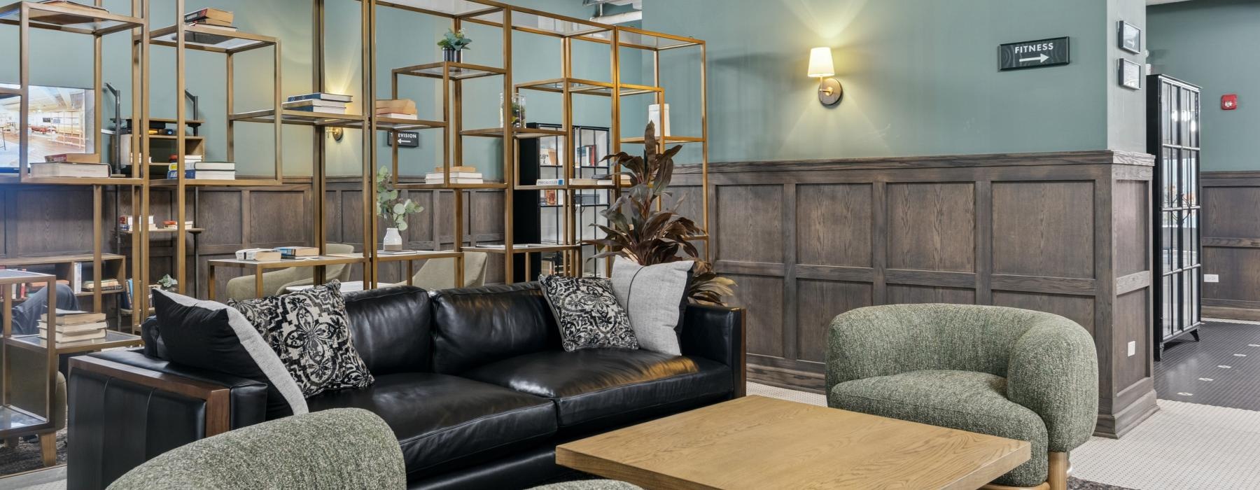 a living room with a couch and chairs