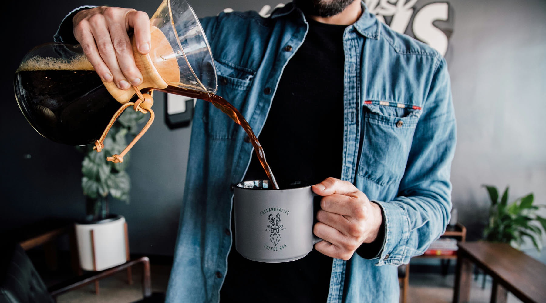 a man holding a coffee cup