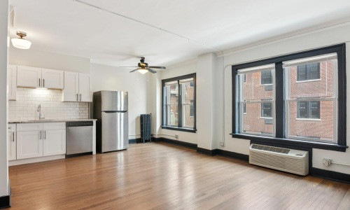 a kitchen with white cabinets