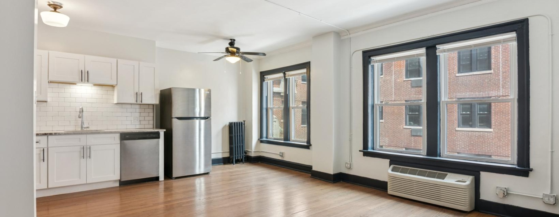 a kitchen with white cabinets