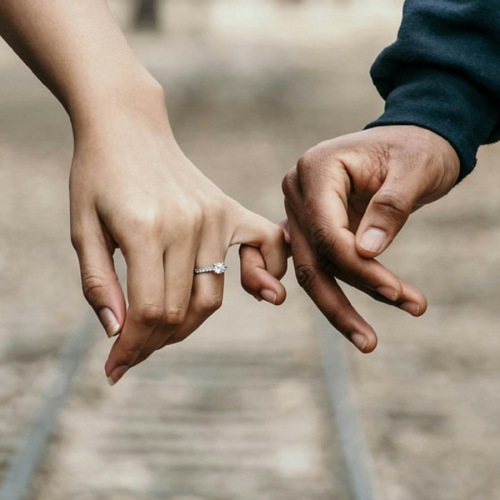 The essence of exceptional living two people linking fingers